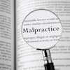 Malpractice Magnifying Glass
