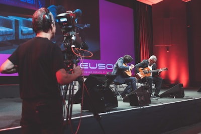 A performance of traditional Portuguese guitar-playing thrilled attendees during the opening ceremony in Lisbon.