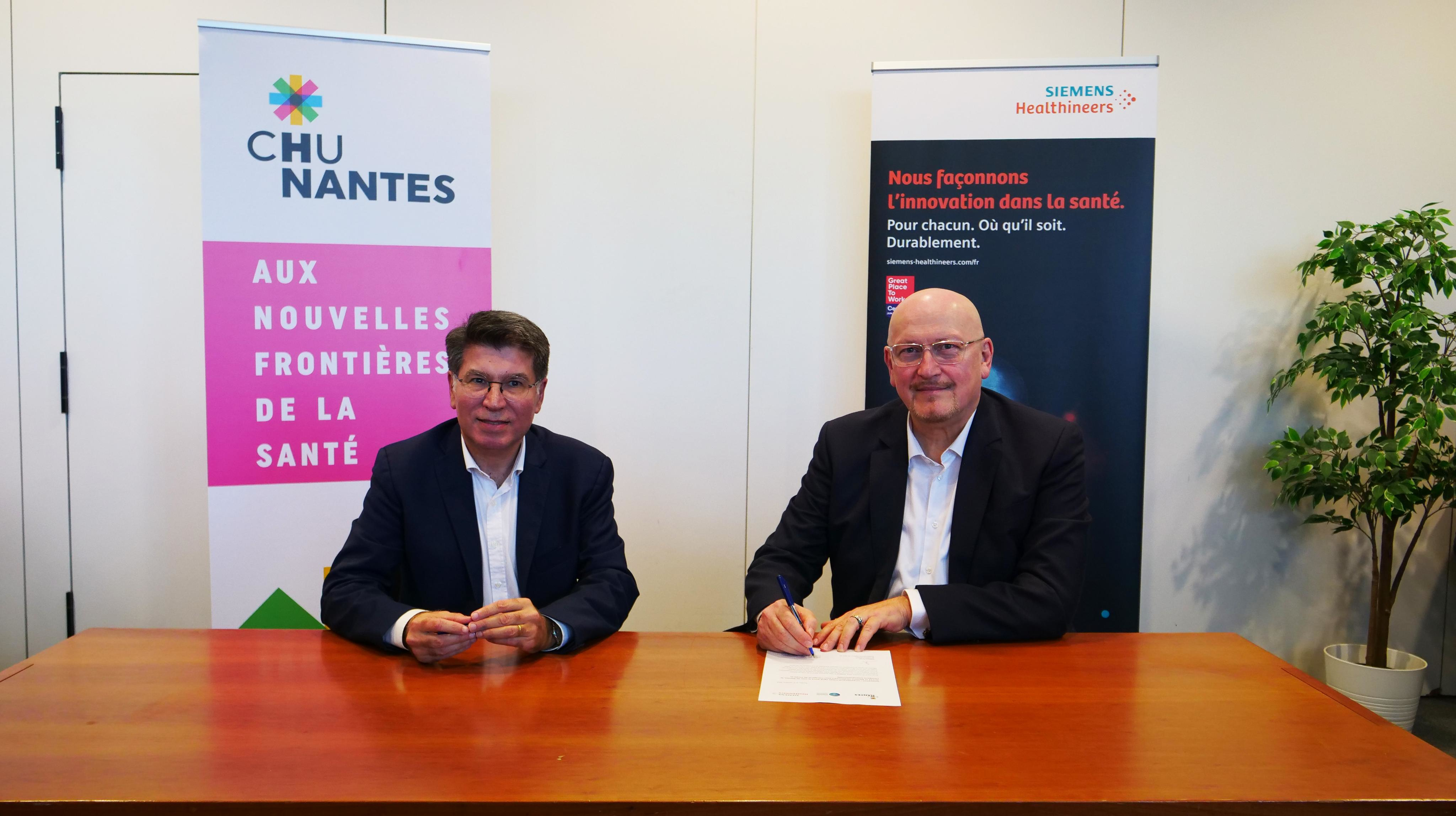 Philippe El Sa&iuml;r (left), CEO of the University Hospital Nantes and Hassan Safer-Tebbi, head of Siemens Healthineers France, Belgium, and Luxembourg, signed the value partnership on 1 October. Image courtesy of Siemens Healthineers.