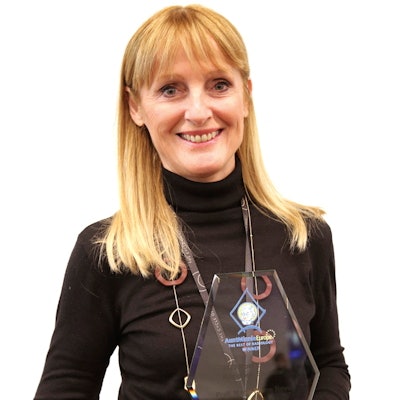 Prof. Marie-Pierre Revel collects her EuroMinnies trophy at ECR 2023. Photo courtesy of Christof Pelz.