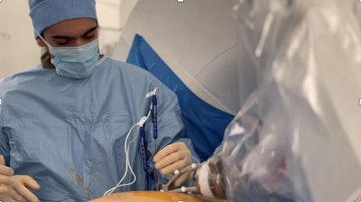 A second-year radiology resident inserts an irreversible electroporation (IRE) needle using Epione, the robotic-assisted platform from Quantum Surgical that supports interventional radiologists in treating inoperable or challenging early-stage tumors. Courtesy of Prof. Laurent Milot.