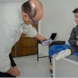A smartphone is used to take an image for a 3D-printed prosthesis.