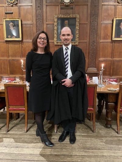 Marion Smits and Prof. Ferdia Gallagher, head of radiology at the University of Cambridge, at the High Table at Gonville & Caius College, Cambridge. The Fellows dine in this area, which is situated in the historic Hall, featuring stained glass and portraits. Photo by Dr. Tomasz Matys