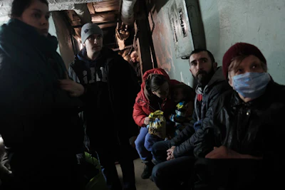 Ukrainians shelter in an air raid bunker during the Russian invasion, Kyiv, 27 February 2022.
