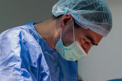 Surgeon performs a carotid artery procedure.
