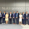Prof. Ken Herrmann, director of the Department of Nuclear Medicine at University Hospital Essen, pictured fourth from the left, at the opening opening of a new nuclear medicine center in Essen, Germany, focused on theranostics and personalized cancer care.