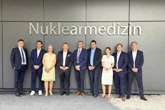 Prof. Ken Herrmann, director of the Department of Nuclear Medicine at University Hospital Essen, pictured fourth from the left, at the opening opening of a new nuclear medicine center in Essen, Germany, focused on theranostics and personalized cancer care.