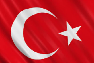 Turkish flag featuring white crescent moon and star on red background