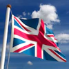 Union Jack flag waving on a flagpole against a bright blue sky with white clouds