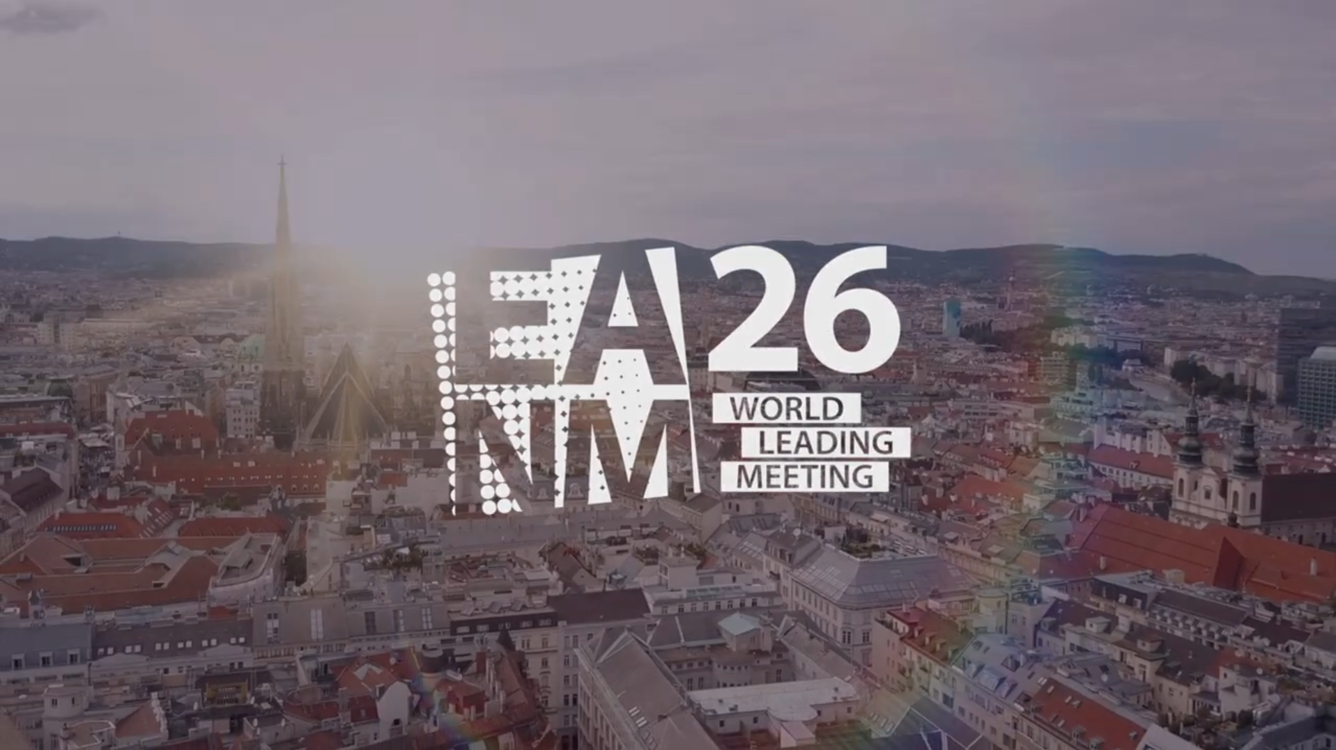 LA26 NMM World Leading Meeting logo displayed over Vienna cityscape