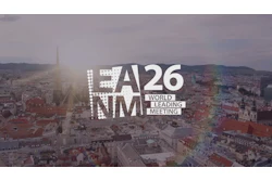 LA26 NMM World Leading Meeting logo displayed over Vienna cityscape