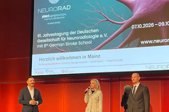 Three speakers presenting at NEURORAD 2026 conference in Mainz, with neurological imagery displayed on screen behind them