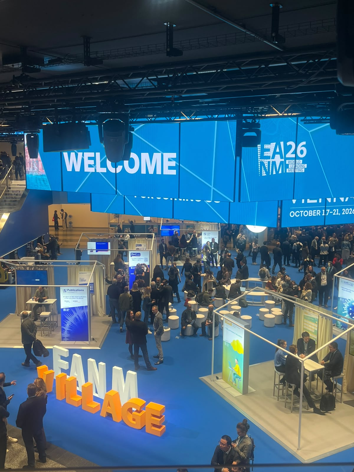 NME Awards 26 venue entrance with welcome signage, blue branding, and attendees gathering in modern exhibition space